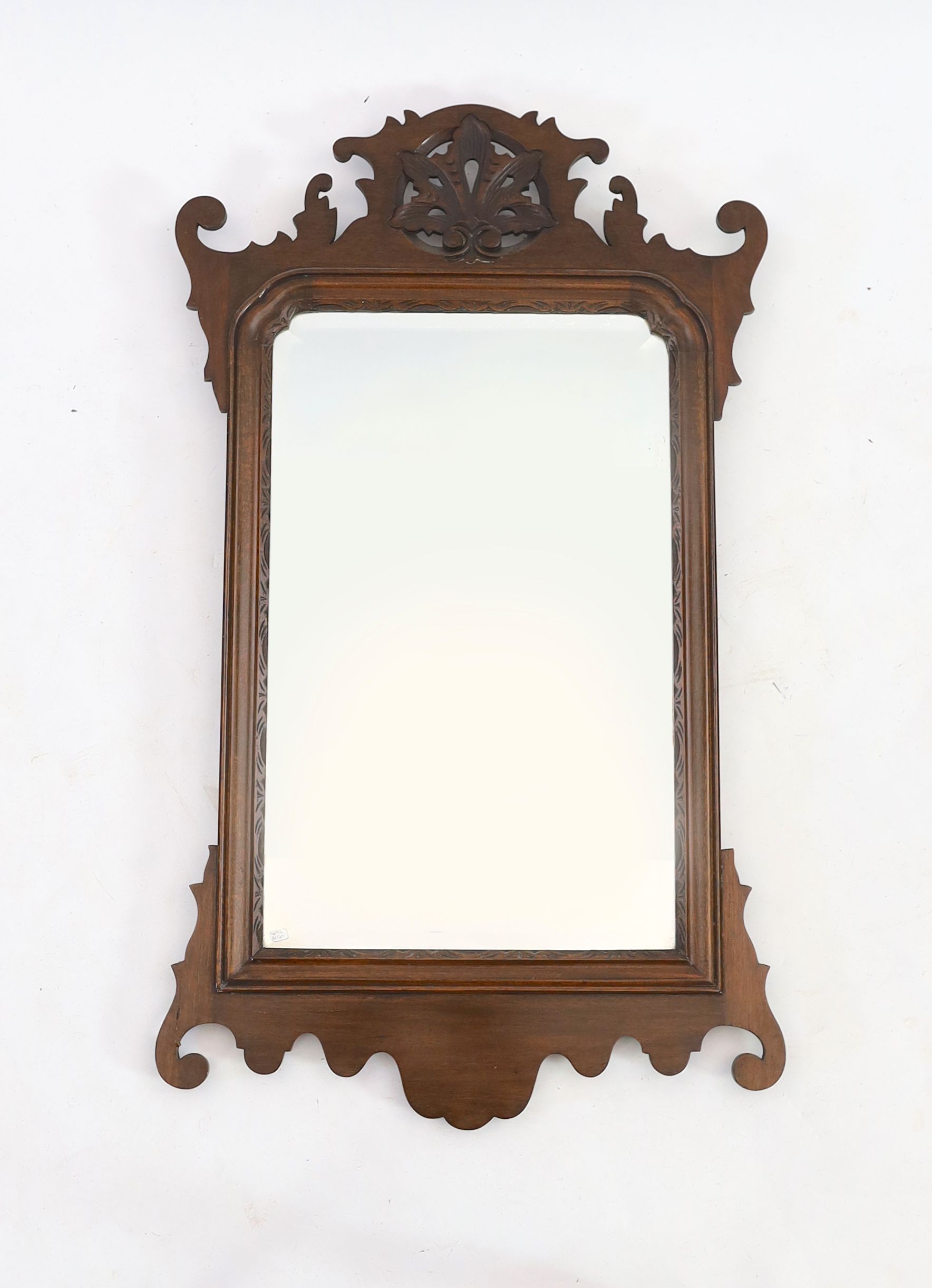 A George III style mahogany fret cut wall mirror, width 50cm height 88cm